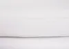 A close-up view of white faux leather upholstery with visible stitching. Náhled obrázku produktu
