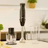A black Braun hand blender with its accessories and a measuring cup are displayed on a white countertop. Anteprima dell’immagine prodotto
