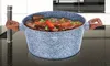 A granite-effect pot filled with stew is placed on a black countertop in a kitchen setting. Náhľad obrázku produktu