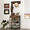 A hallway or entryway with a shoe rack, coat rack, and decorative items. Anteprima dell’immagine prodotto