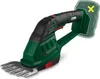 A cordless grass and shrub shear is shown against a white background. A dotted outline and a yellow 'X' mark indicate that the battery and charger are not included. Produktbild-Vorschau