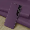A purple flip case for a smartphone is shown on a textured purple surface. Náhľad obrázku produktu