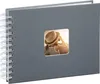 A gray spiral-bound photo album with a square window on the cover displaying a photo of a young girl wearing a hat. Produktbild-Vorschau