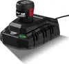 A black battery charger with a battery inserted, shown from a slightly elevated angle. Náhled obrázku produktu