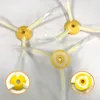 Three replacement side brushes for a robot vacuum cleaner are laid out on a white surface. Two close-up insets show the attachment mechanism of two of the brushes. Voir les images du produit