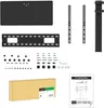A flat lay of various components and a box for a TV stand, along with an instruction manual. Anteprima dell’immagine prodotto