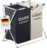 A two-compartment laundry basket with a tag indicating it is a German brand. Anteprima dell’immagine prodotto