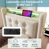 A close-up view of a bed's headboard with integrated charging features, showcasing a tablet and phone charging. Produktbild-Vorschau