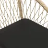 A close-up view of a black surface with a woven rattan pattern in the background. Náhled obrázku produktu