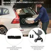 A man loading a folded baby stroller into the trunk of a car. Produktbild-Vorschau