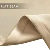 A close-up view of a beige fabric seam, highlighting the flat seam construction. Produktbild-Vorschau