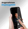 A hand holding a smartphone, showing the camera interface with a person's face in the frame. Produktbild-Vorschau