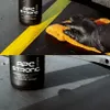 A hand in a black glove is cleaning a surface with an orange microfiber cloth, next to a bottle of K2 APC STRONG PRO cleaner. Náhled obrázku produktu