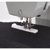 A close-up view of a sewing machine's presser foot and buttonhole attachment on dark fabric. Anteprima dell’immagine prodotto