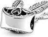 A close-up shot of a silver charm with feather details. Produktbild-Vorschau