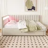 A beige upholstered daybed with a channel-tufted headboard and integrated LED lighting is shown in a bedroom setting. Náhled obrázku produktu