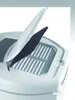 A close-up view of a white appliance, possibly a deep fryer, with its lid open to reveal a filter. Náhled obrázku produktu