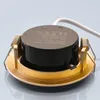 A close-up view of a gold-colored LED downlight with a black driver unit and a white wire. Produktbild-Vorschau