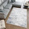 A modern living room with a sectional sofa and a rug. Náhled obrázku produktu