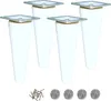 Four white tapered furniture legs with silver mounting plates are shown on a white background. A small pile of screws and four felt pads are also visible at the bottom of the image. Podgląd zdjęcia produktu