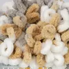 A close-up view of fluffy yarn in various colors. Produktbild-Vorschau