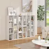 A white bookshelf filled with books and decorative items, placed in a room with light-colored walls and wooden flooring. Produktbild-Vorschau