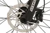 A close-up view of a bicycle's front wheel disc brake and suspension fork. Produktbild-Vorschau