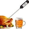 A digital thermometer is shown inserted into a cooked turkey, with a mug of beer next to it. Produktbild-Vorschau