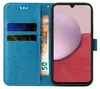 A blue flip cover phone case with floral and butterfly embossing, showing credit cards and a banknote inserted. Produktbild-Vorschau