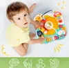 A baby is playing with an interactive music toy on a white background. Produktbild-Vorschau