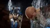 A character from Mortal Kombat 11 Ultimate is shown in action, wielding an ice axe and about to strike a monstrous creature encased in ice. Produktbild-Vorschau
