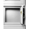 An open metal cabinet with a grey interior and a brass lock mechanism with two keys. The cabinet door is slightly ajar. Podgląd zdjęcia produktu