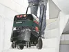 A person is pulling a Metabo vacuum cleaner up a concrete staircase. Náhľad obrázku produktu