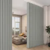 A bedroom with a bed and a room divider. Náhľad obrázku produktu