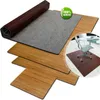 A bamboo floor mat is shown rolled up and unrolled, with a close-up of its texture and a smaller inset image showing it in use under an office chair. Anteprima dell’immagine prodotto