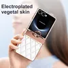 A person is holding a white and rose gold flip phone case with a ring holder. Produktbild-Vorschau