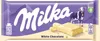 A Milka white chocolate bar with a cow and mountains on the packaging. Náhled obrázku produktu