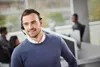 A man wearing a headset in an office environment. Anteprima dell’immagine prodotto