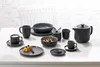 A table setting with a dark gray dinnerware set, including plates, bowls, cups, and a teapot. Produktbild-Vorschau