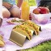 A picnic scene with tacos, juice, and fruit. Produktbild-Vorschau