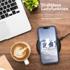 A desk scene with a laptop, coffee, and a smartphone charging wirelessly. Produktbild-Vorschau