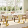 A dining table set with chairs in a well-lit room with large windows. Produktbild-Vorschau