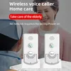 An elderly woman and a caregiver are shown, with two wireless voice caller devices in the foreground. Podgląd zdjęcia produktu