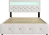 A white upholstered bed frame with a tufted headboard and LED lighting. Produktbild-Vorschau