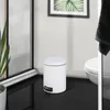 A white pedal bin is shown in a bathroom setting next to a toilet. Produktbild-Vorschau