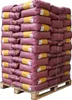 A pallet stacked with bags of STROY Strohpellets Einstreu. Produktbild-Vorschau