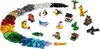 A collection of LEGO bricks and small, pre-built LEGO models arranged in a spiral pattern on a white background. Produktbild-Vorschau