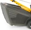 A close-up view of the grass catcher and yellow handle of a lawnmower. Produktbild-Vorschau