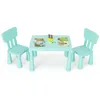 A child's table and two chairs set, with some coloring supplies and books on the table. Produktbild-Vorschau