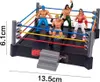 A toy wrestling ring with four wrestler figures and a set of stairs. Produktbild-Vorschau
